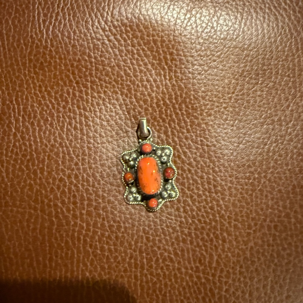 Silver Pendant with Coral Stones .